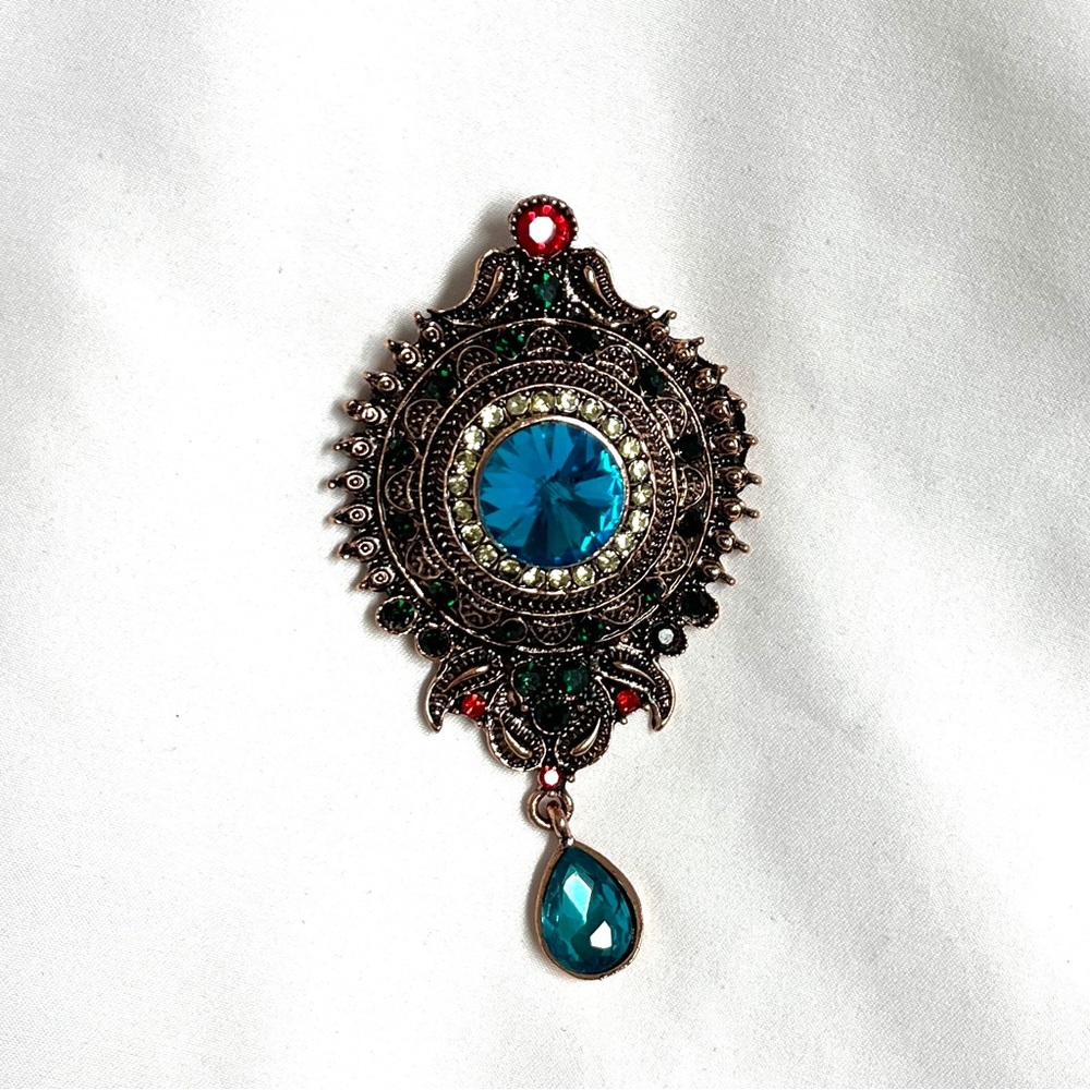 Brooch, Vintage design, NIP, deep metal tones with blue rhinestones, dangle bead